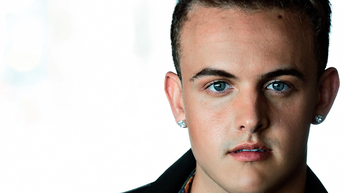 Matthew James is pictured against a white background, wearing a black leather jacket.