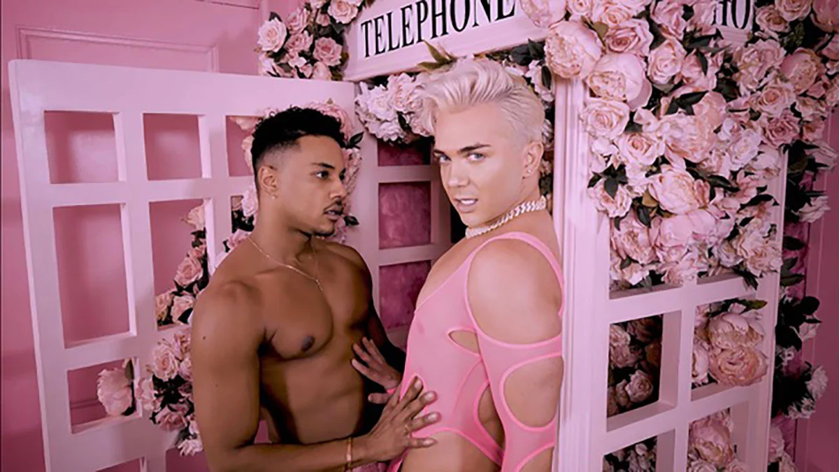 Picture of PrettiBoiRoq with an topless male actor. PrettiBoiRoq has light pink top.