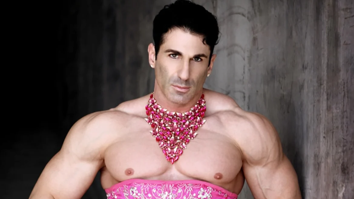 Queen Sir JET in Pink strapless dress with pink neckless. Muscular