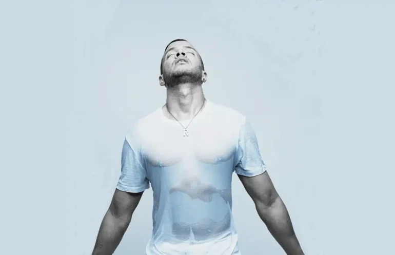 Rihan in white wet t-shirt - muscle tones can be seen through!